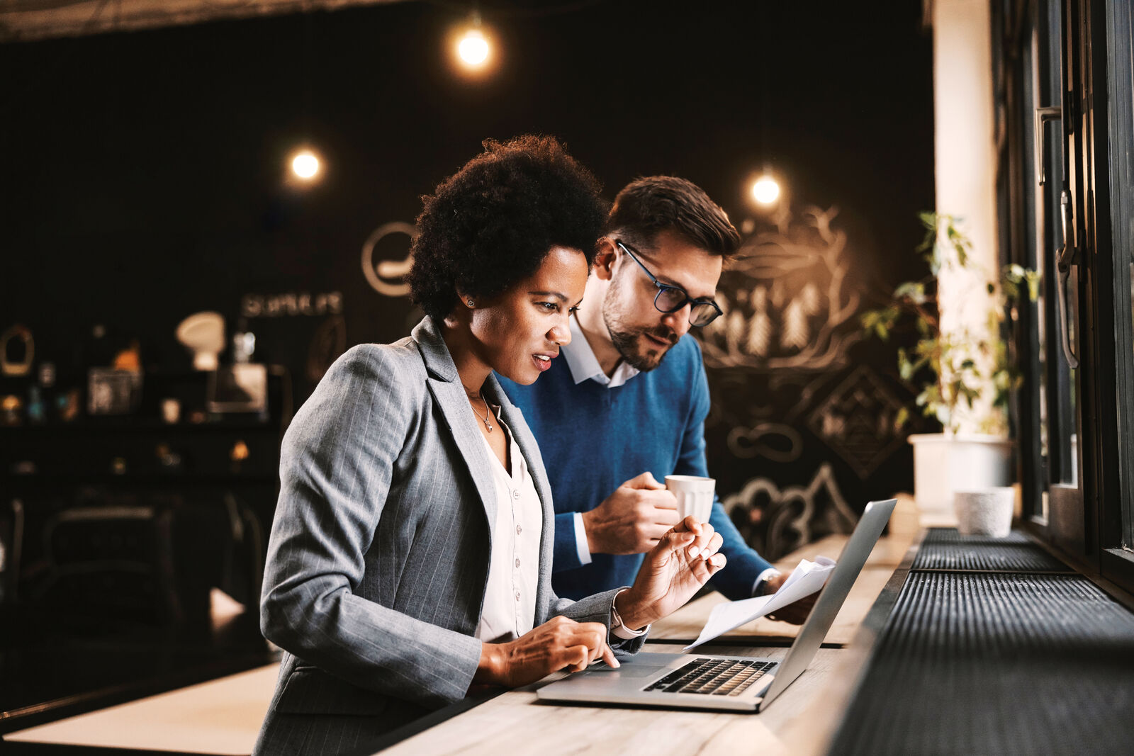 Two colleagues working side by side