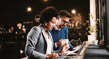 Two colleagues working side by side