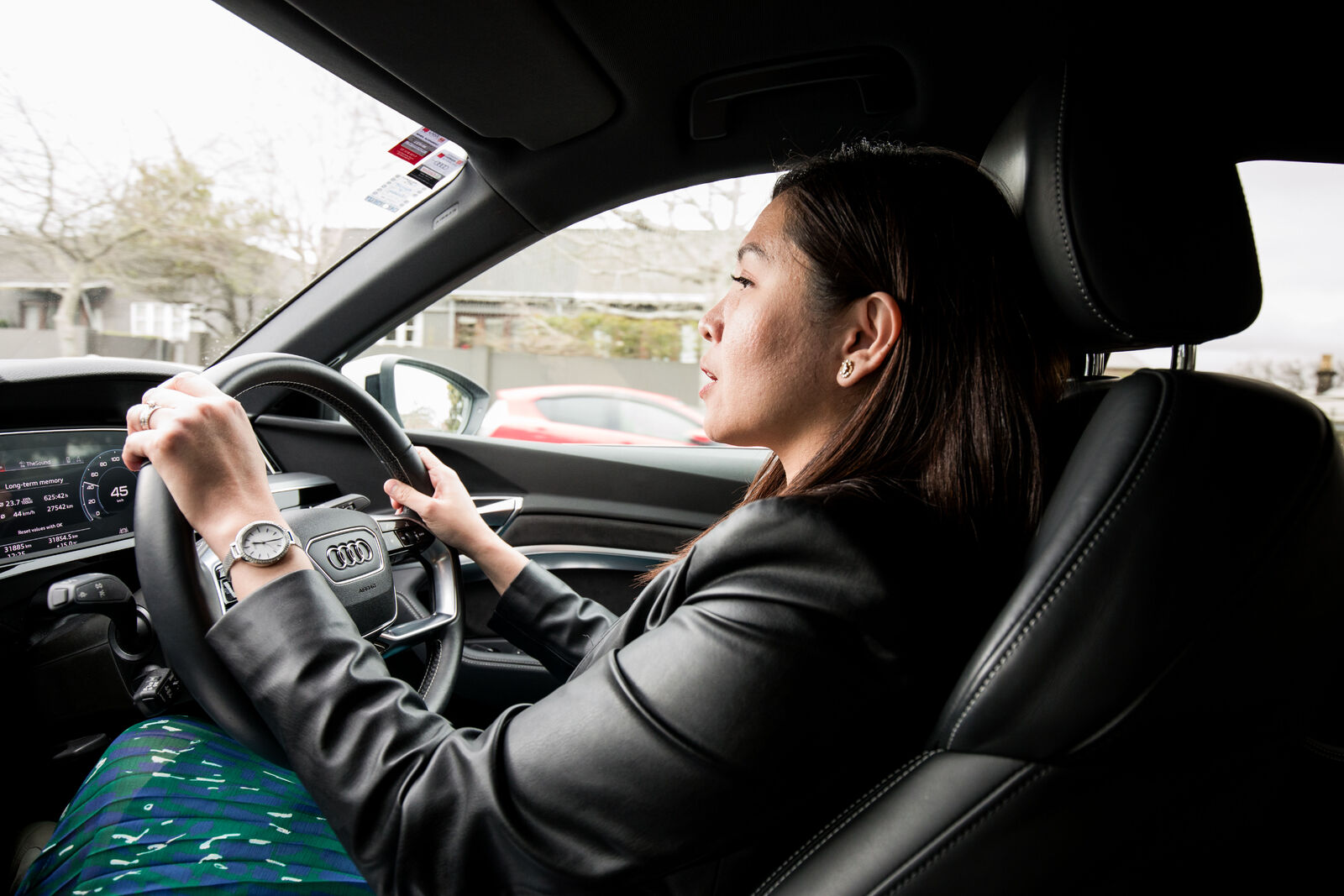 woman behind the wheel of a car