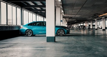 Car park with some vehicles and empty bays