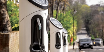 Row of EV chargers on roadside