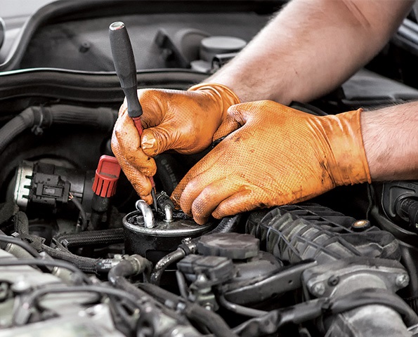 mechanic-servicing-car-close-up mechanic-servicing-car-close-up