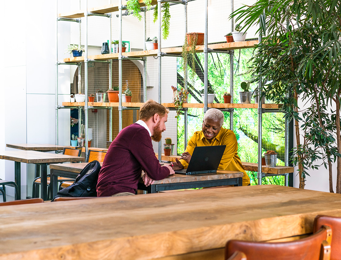 two-professionals-viewing-laptop