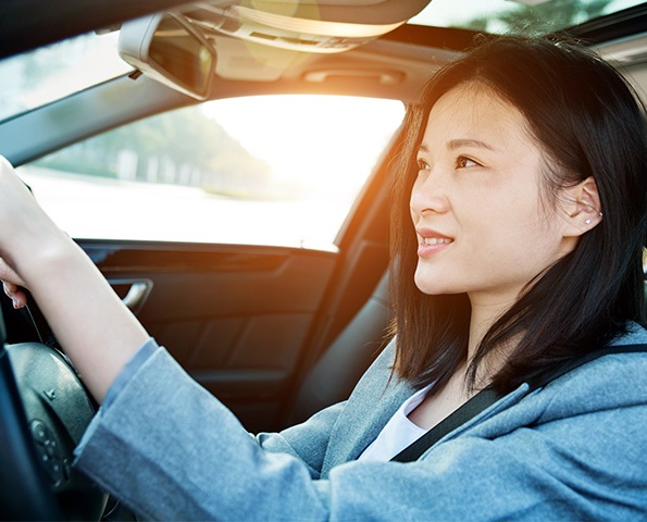 woman-driving-car-smiling